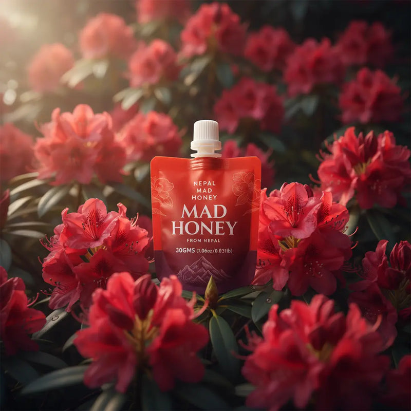 Red Mad Honey packaging surrounded by rhododendron  flowers